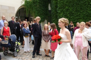 The bride is going to throw the bouquet