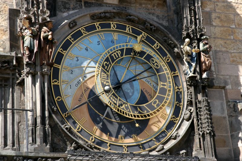 Astronomical clock dial and the four virtues : Vanity, Miser, Death, Turk (from left to right)