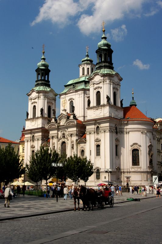 Horse carriage in front of the St. Nicholas Church in the Old Town Square