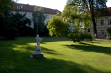 White statue in the green summer