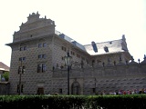 Schwarzenberg Palace is iluminated by gas lamps in the night, now in sunlinght