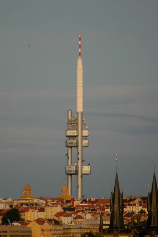 The Zizkov Television tower and the toewers of Tyn Church